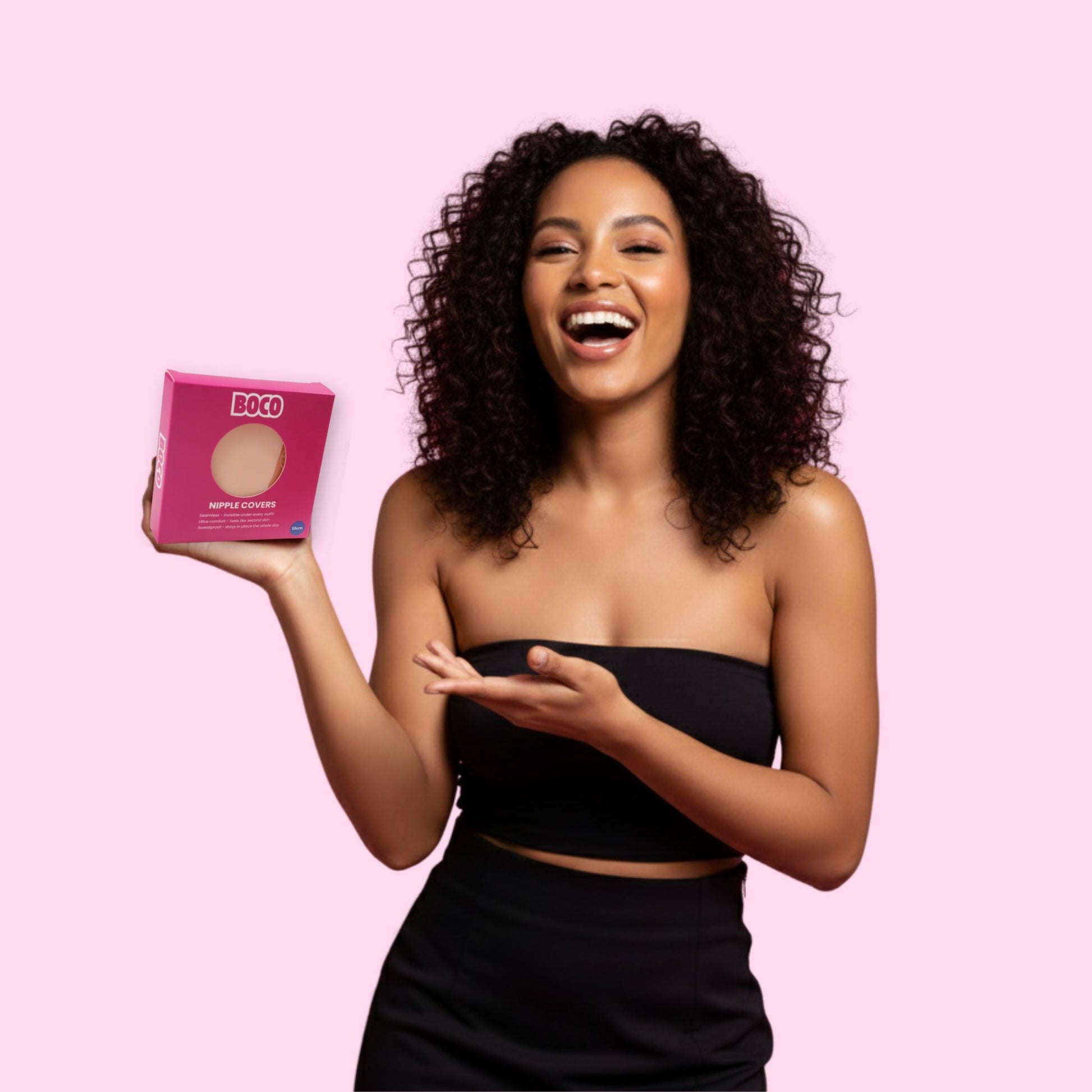 Woman holding a pink box with 'BOCO' branding against a pink background