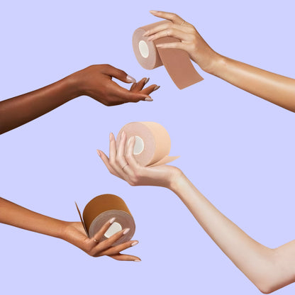Four hands reaching out to touch rolls of boob tape tape against a light blue background